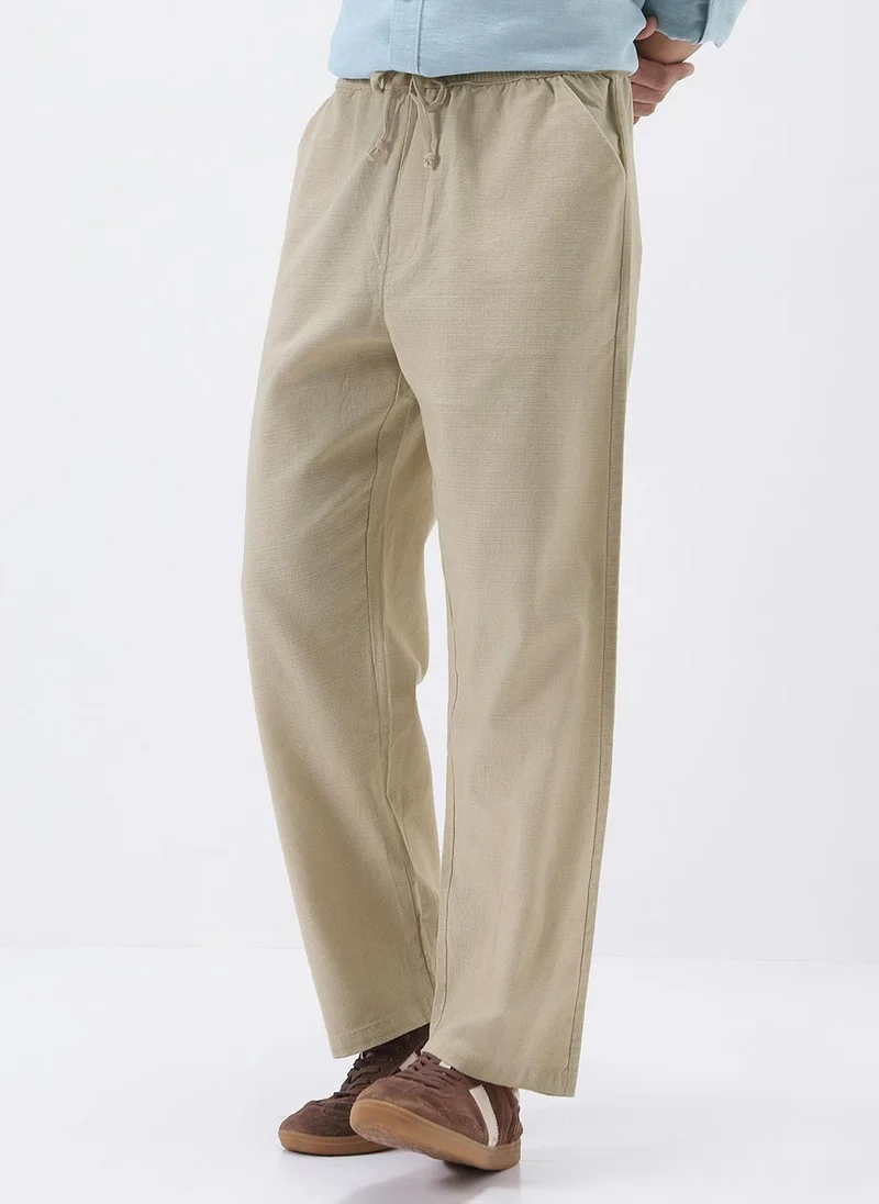 Urbano Fashion  Urbano Fashion Men's Beige Loose Fit Solid Linen Blend Trousers Non-Stretchable for Men | Best Price UAE